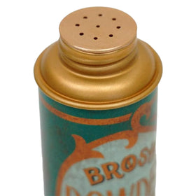 BROSH product in use as fingers apply powder to roots for instant lift and texture
