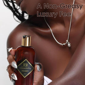 Brown Sugar Babe beside a hand to show bottle size and travel-friendly benefit