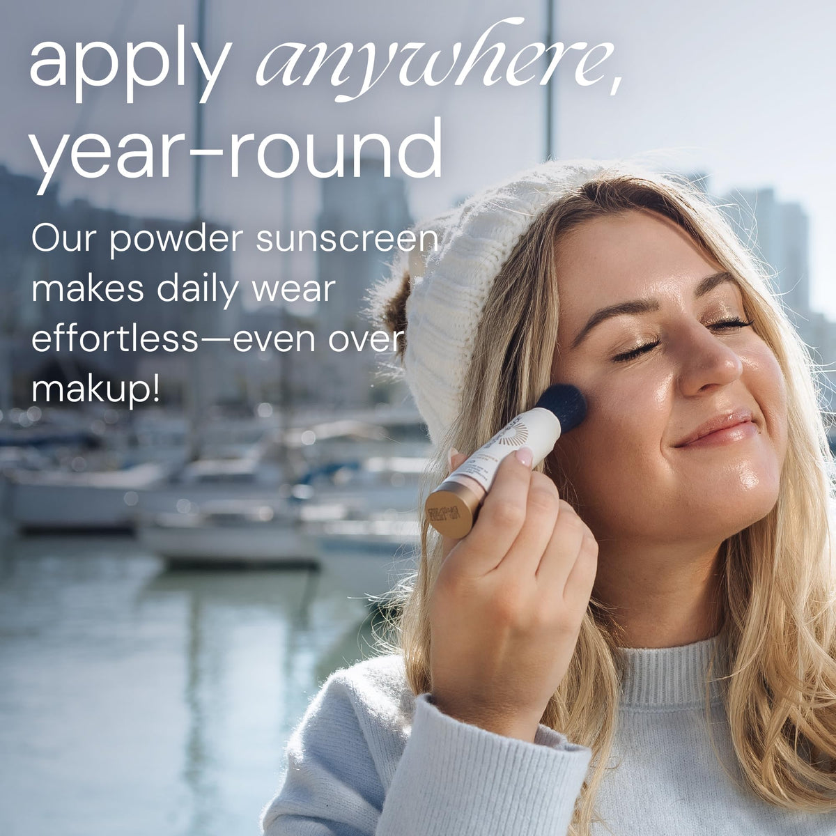 Brush On Block brush applying translucent powder to cheek for effortless protection