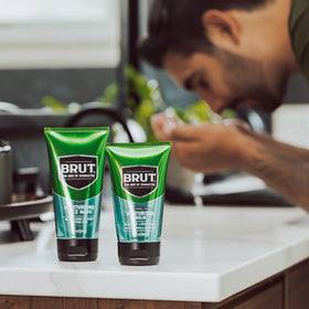 BRUT tube in hand showing 3.5 oz scale and portable grooming benefit