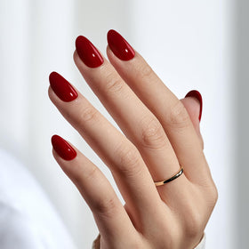 BTArtbox Cardinal nails on a hand demonstrating natural oval fit