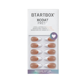 BTArtbox hand applying a press-on nail showing easy at-home application benefit