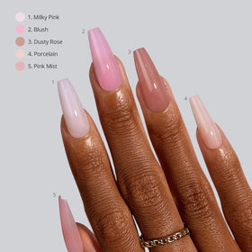 BTArtboxnails hands applying press-on nails demonstrating easy at-home use