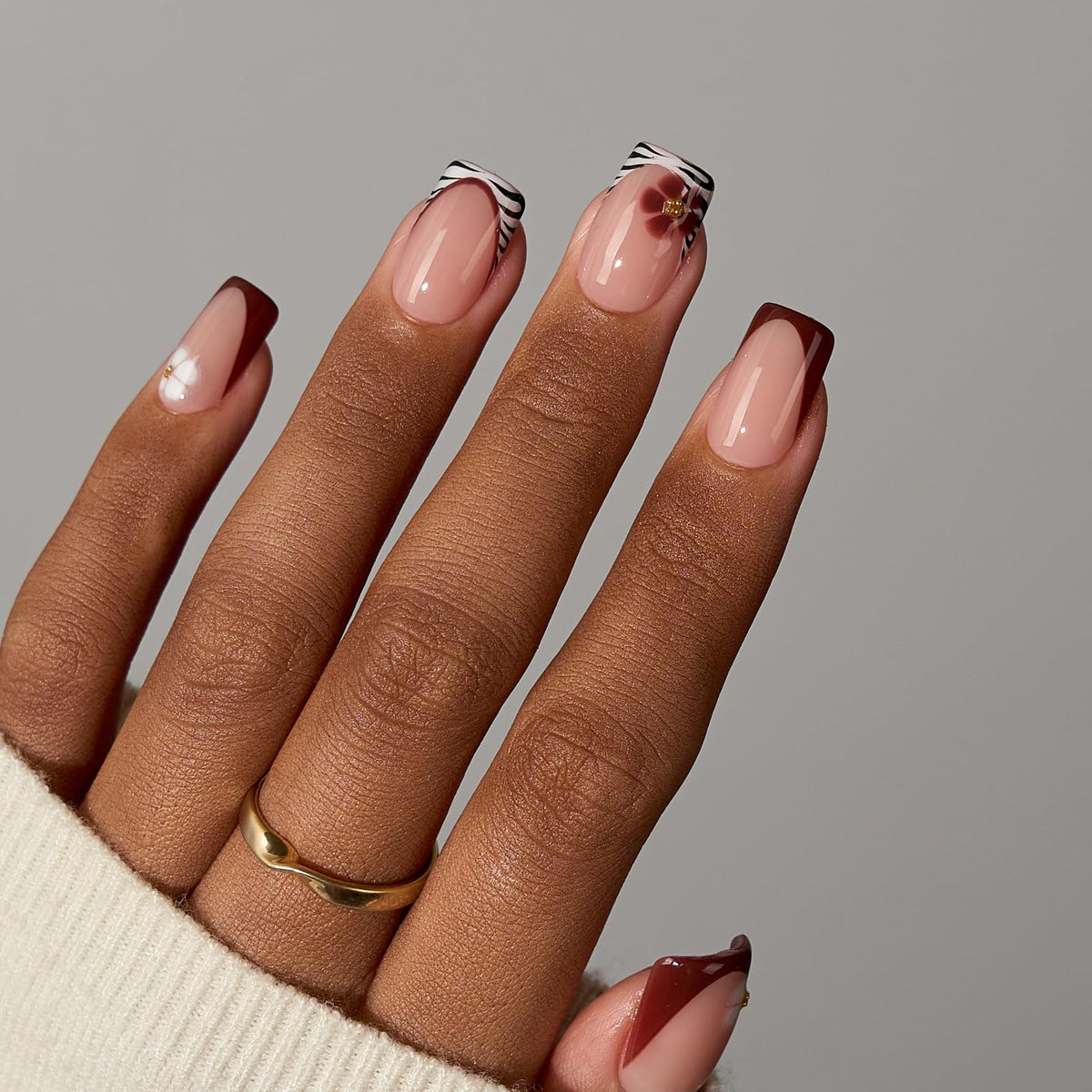 BTArtboxnails shown on hand displaying natural-looking French manicure