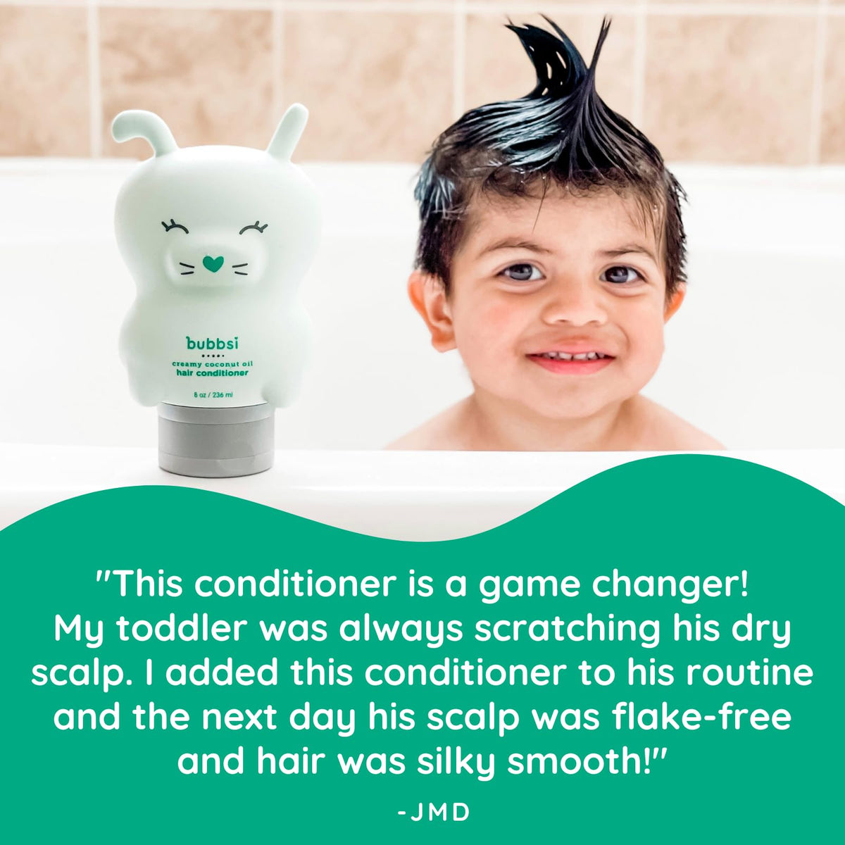 Bubbsi conditioner in caregiver hand ready to apply, easy squeeze bottle convenience