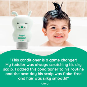 Bubbsi conditioner in caregiver hand ready to apply, easy squeeze bottle convenience