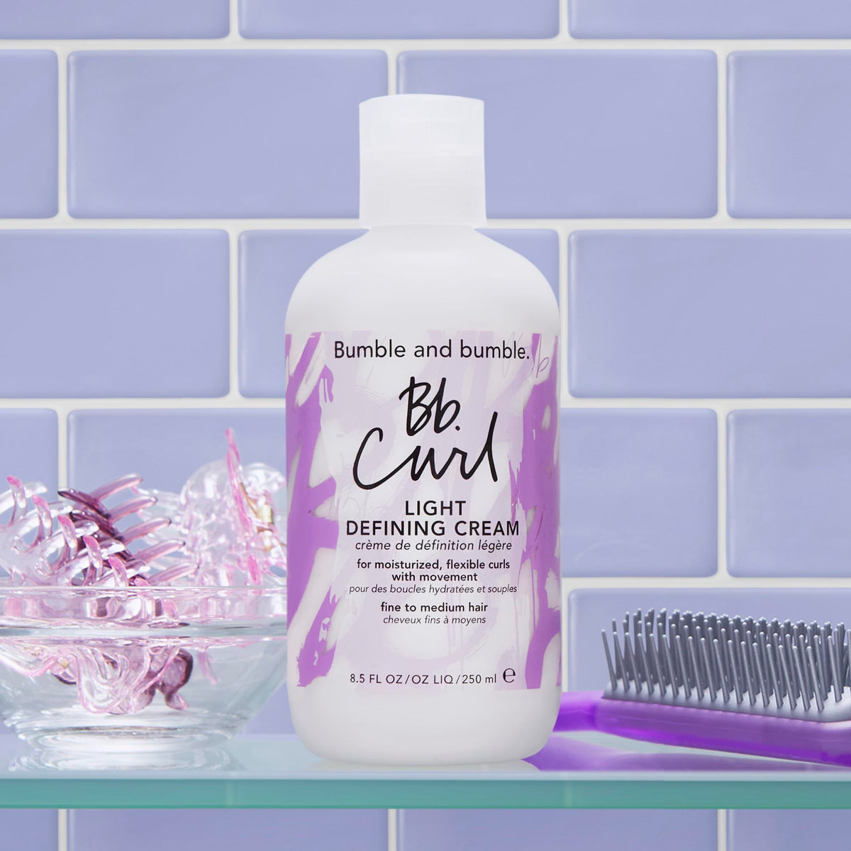 Bumble and bumble 8.5 fl oz next to a bottle for size comparison