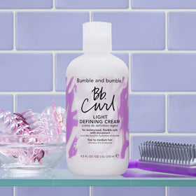 Bumble and bumble 8.5 fl oz next to a bottle for size comparison