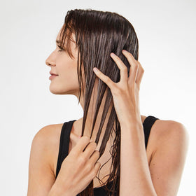 Bumble and bumble application on damp hair demonstrating even distribution and root lift