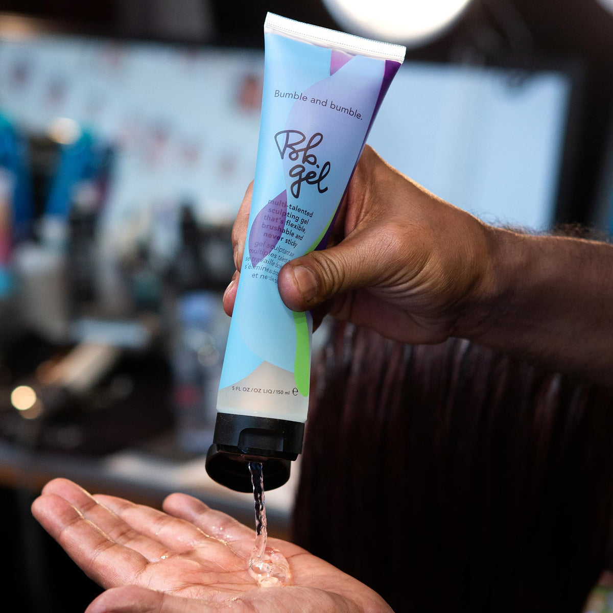 bumble and bumble gel in use styling hair demonstrates hold and brushable finish benefit