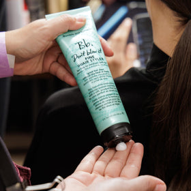 Bumble and bumble being applied to damp hair for instant body and lift