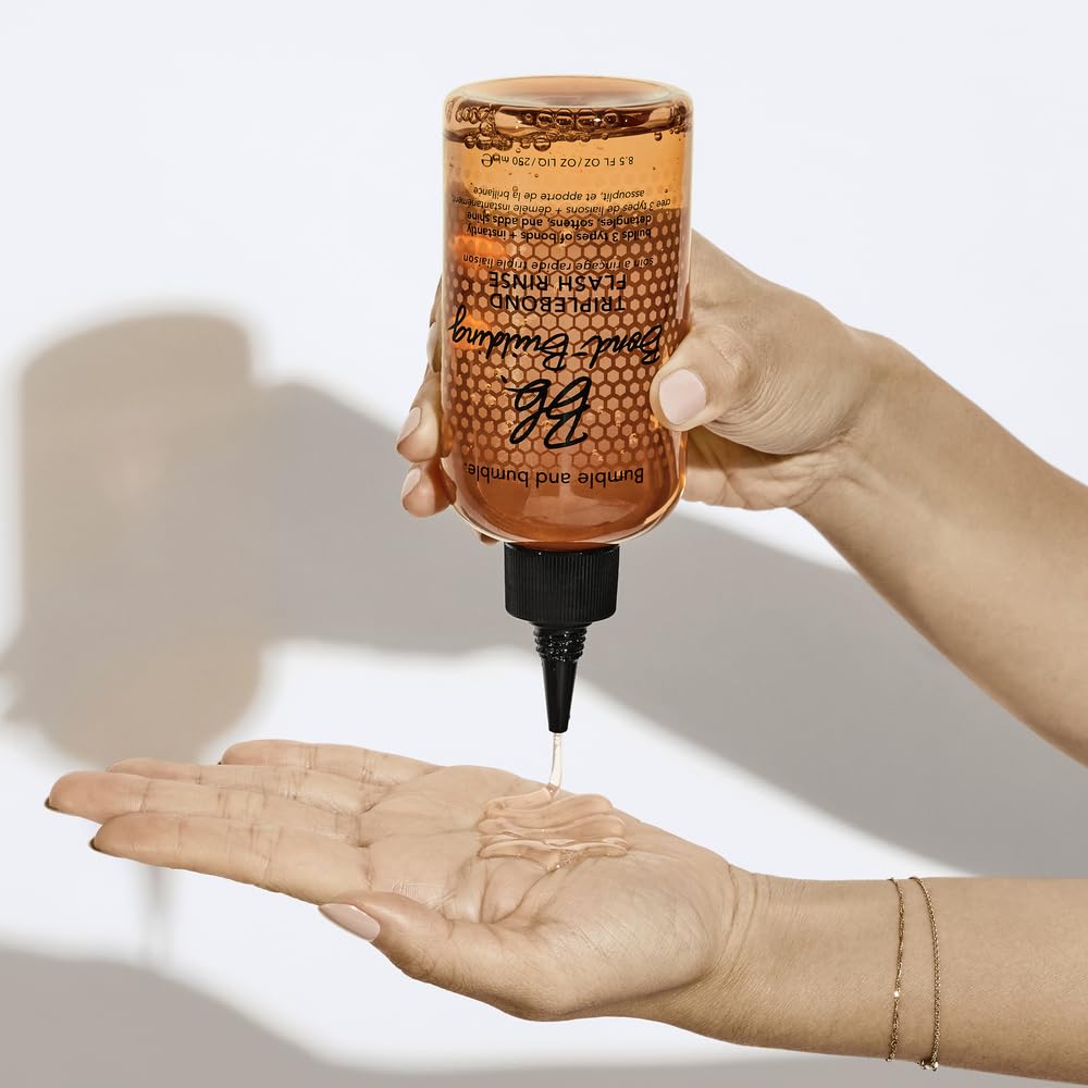 Bumble and bumble applying Flash Rinse to damp hair in hands for instant detangling and better manageability