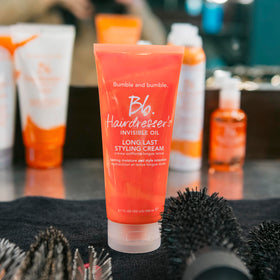 Bumble and bumble in a bathroom scene suggesting everyday styling routine benefit