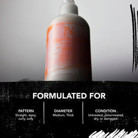 Bumble and bumble bottle held in hand to show real-life 11.8 fl oz size comparison