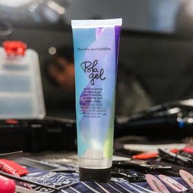 bumble and bumble on bathroom shelf beside tools suggests everyday salon-quality styling