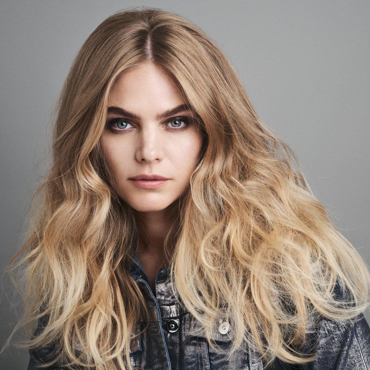 Bumble and bumble shampoo in travel kit lifestyle scene for easy-on-the-go volume benefit