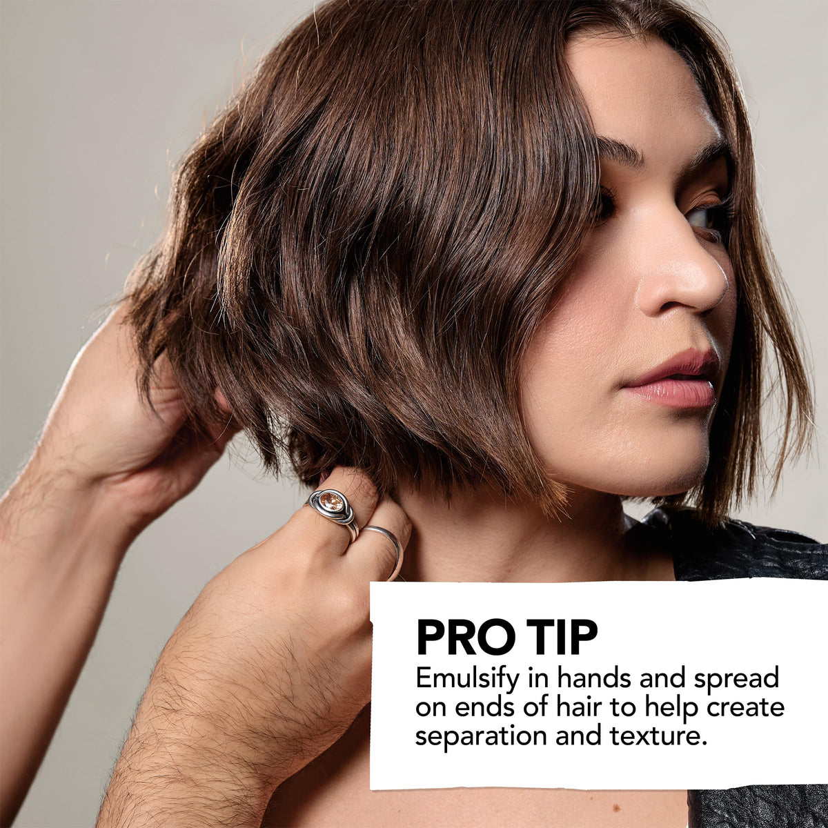 Bumble and bumble on fingertips demonstrates easy application and controlled styling benefit