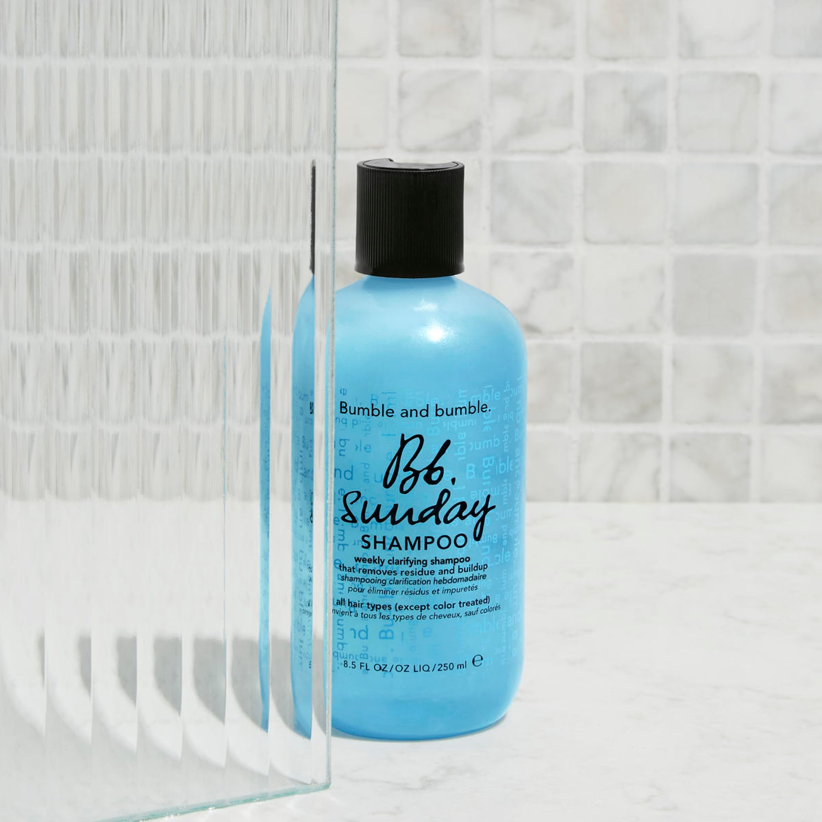 Bumble and bumble bottle on bathroom shelf suggesting weekly reset routine