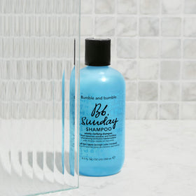 Bumble and bumble bottle on bathroom shelf suggesting weekly reset routine