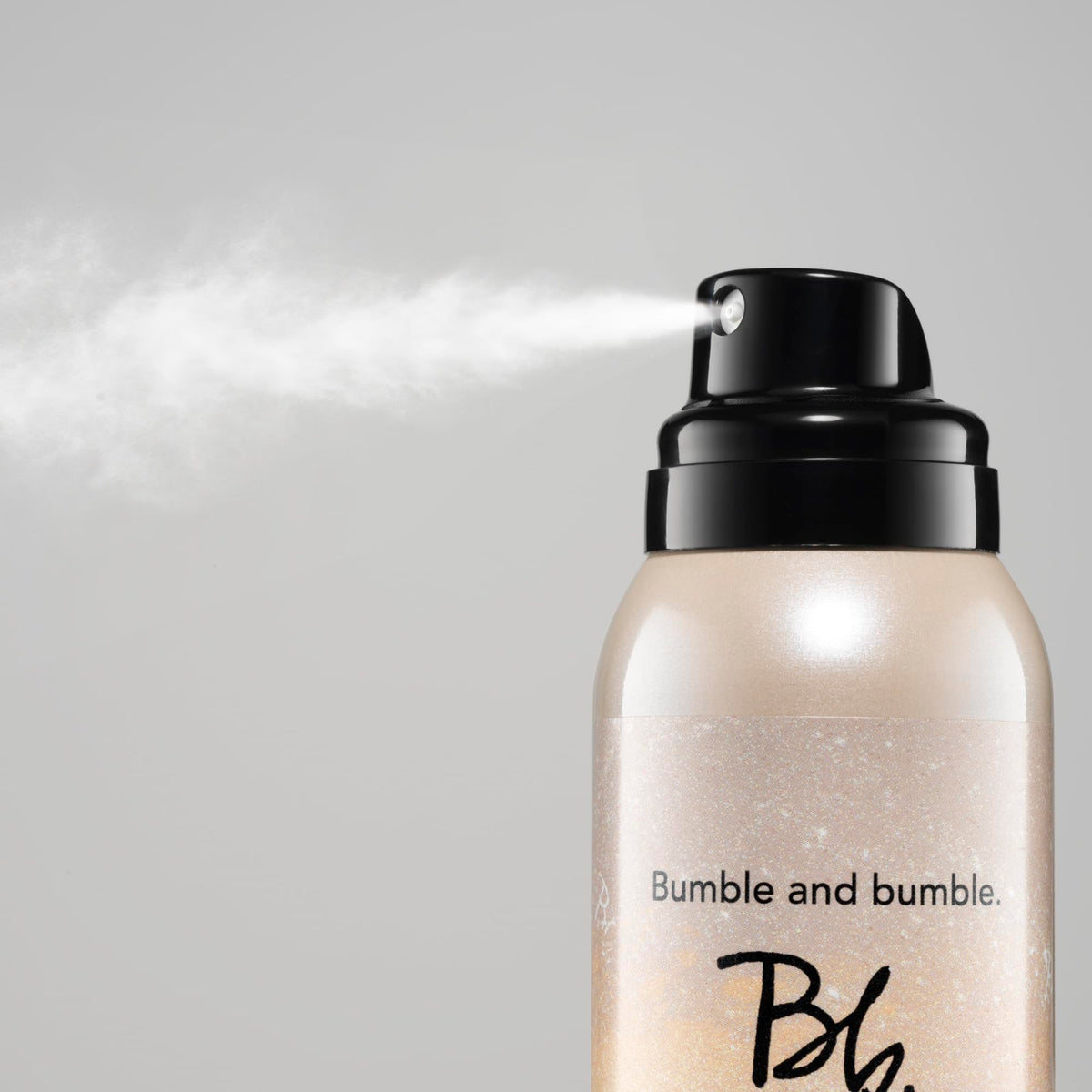 Bumble and bumble spray nozzle mid-action delivering invisible coverage