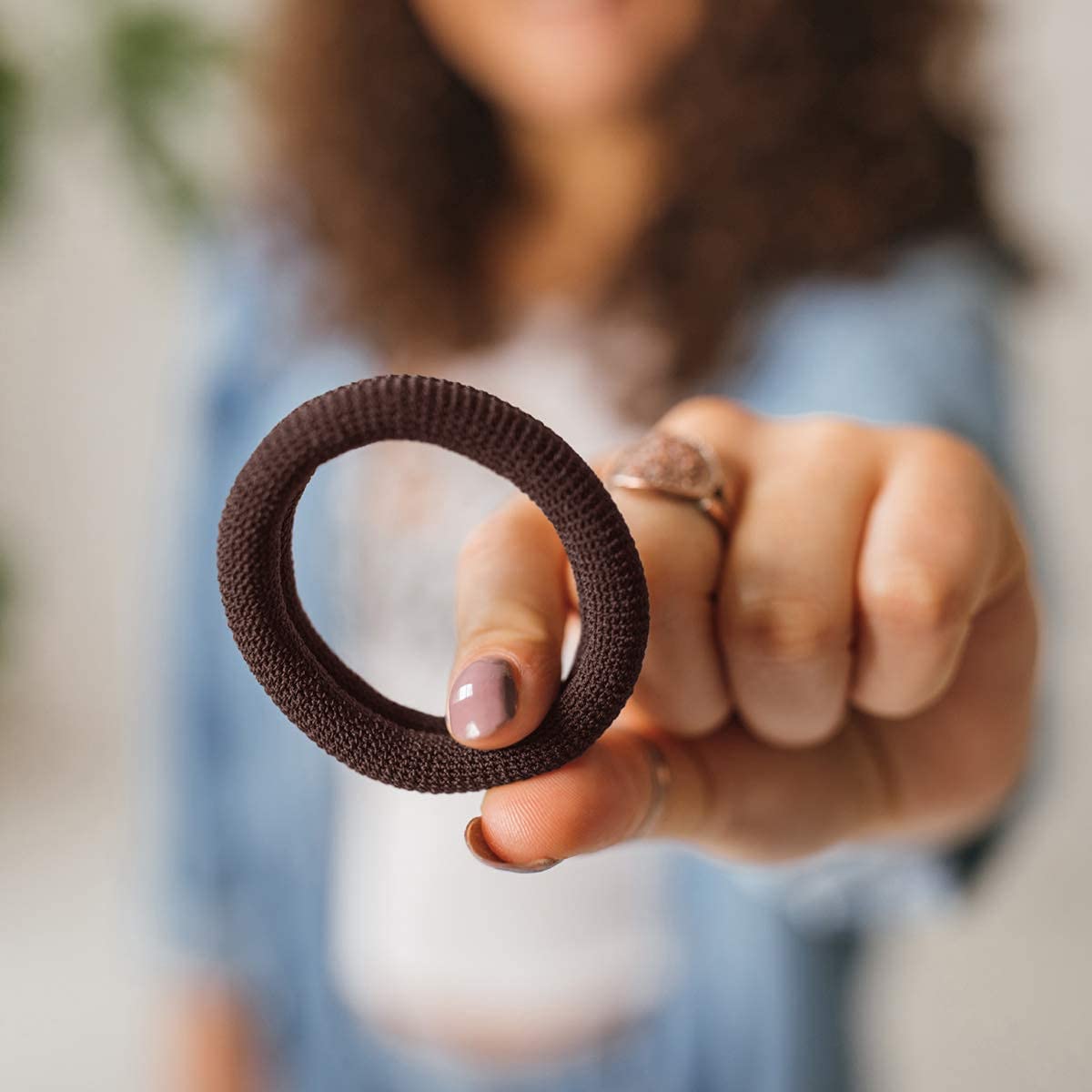 Burlybands securing a curly ponytail for no-slip active use