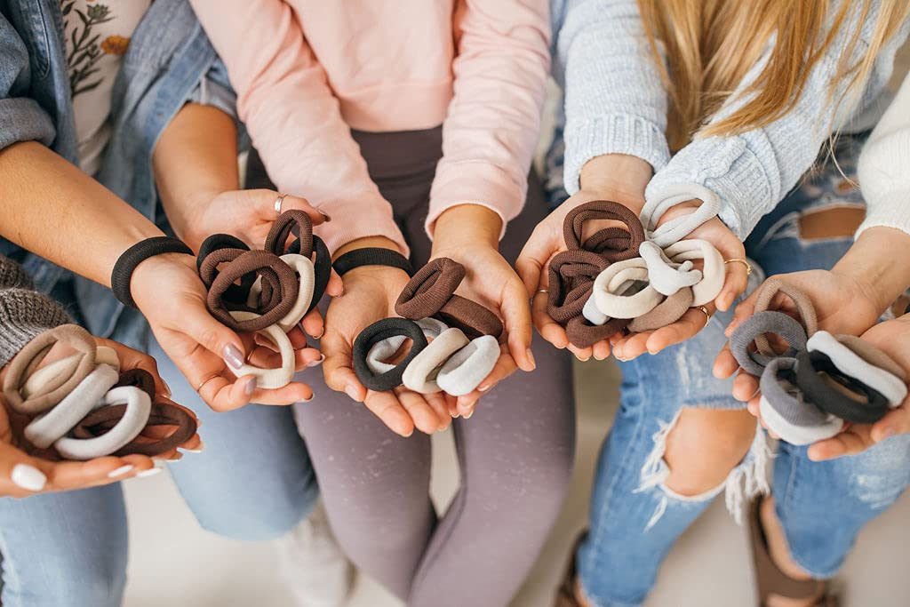 Hand holding a Burlyband to show scale and extra-large circumference