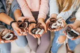 Hand holding a Burlyband to show scale and extra-large circumference