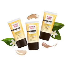 Burt's Bees applied on hand demonstrating coverage and hydration benefit