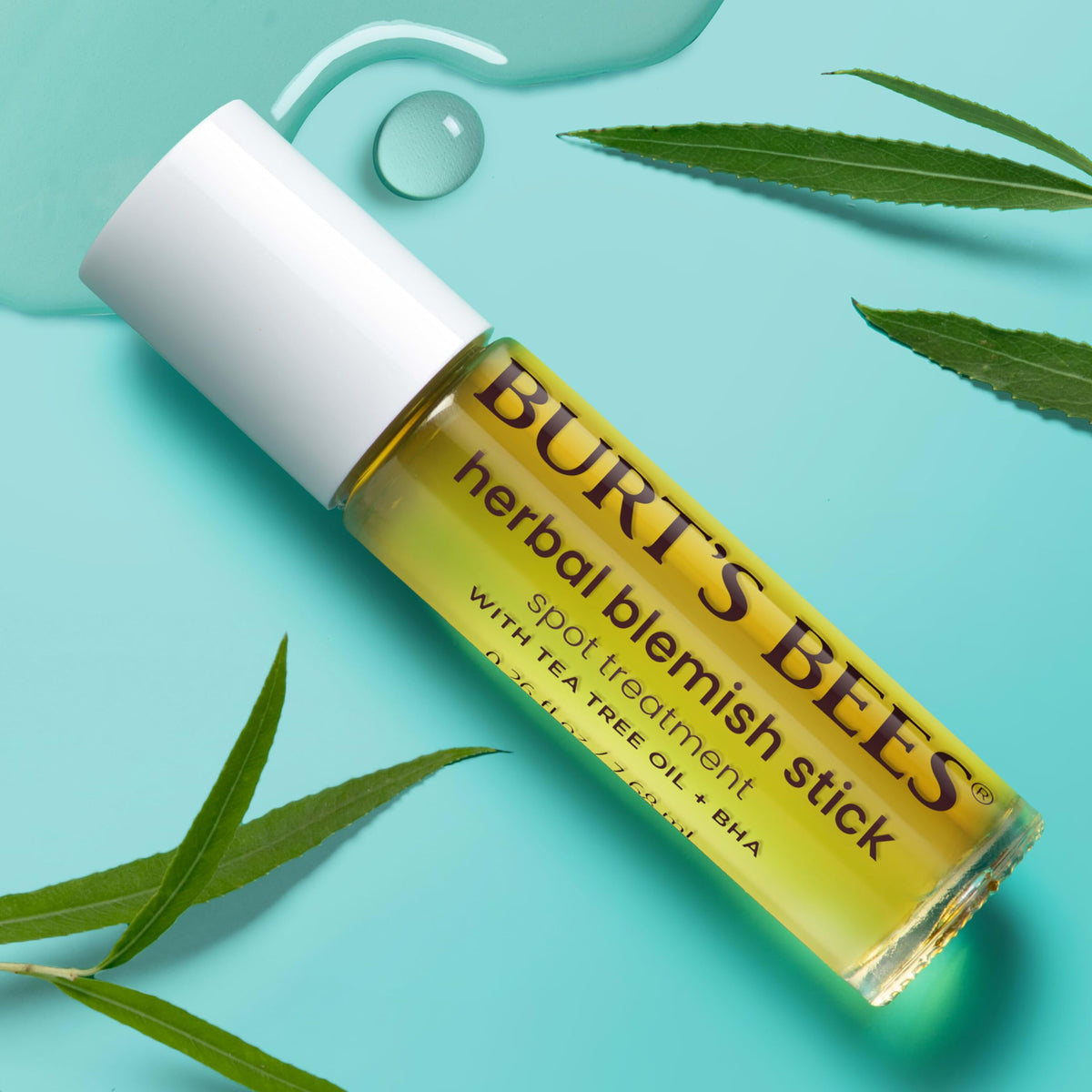 Burt's Bees blemish stick in hand demonstrating quick spot application