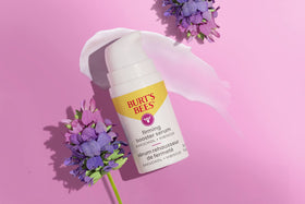 Burt's Bees bottle label close-up showing product name and clean-ingredient benefits