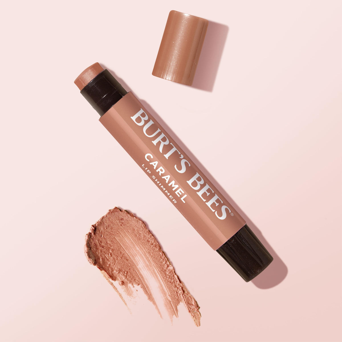 Four-pack group shot of Burt's Bees caramel shimmer sticks showing value bundle