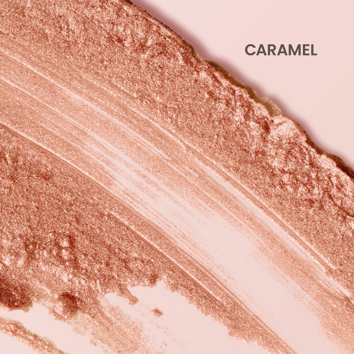 Swatch of Burt's Bees caramel shimmer on skin highlighting warm tawny-beige glow