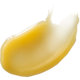 Burt's Bees cream being applied to foot in hand for visible moisturization