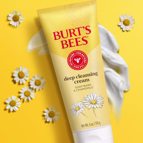 Burt's Bees cream applied to cheek, illustrates gentle cleansing