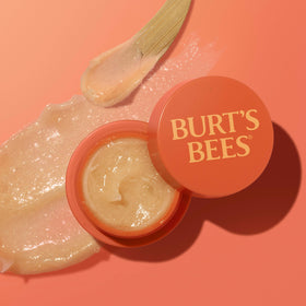 Burt's Bees jar on bedside table in lifestyle scene suggesting nightly routine benefit