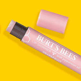 Burt's Bees in purse lifestyle shot demonstrating on-the-go hydration benefit