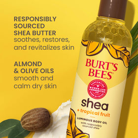 Burt's Bees oil poured into palms demonstrating easy spread and hydration