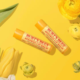 Burt's Bees on desk with school supplies for convenient classroom use