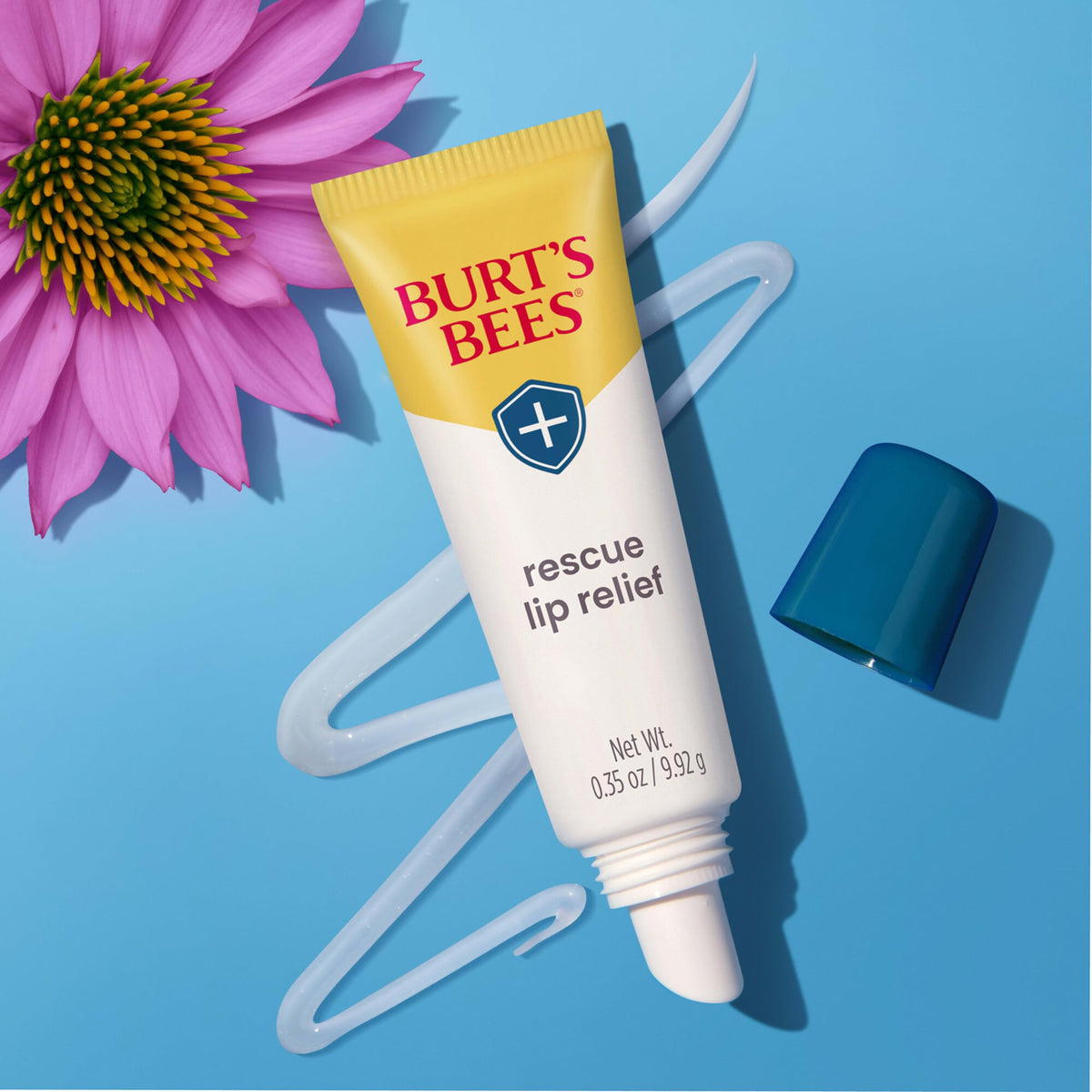 Burt's Bees tube inside a purse demonstrating on-the-go moisturization convenience
