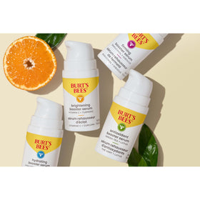 Algae and botanicals beside Burt's Bees serum representing natural-derived ingredients and nourishment