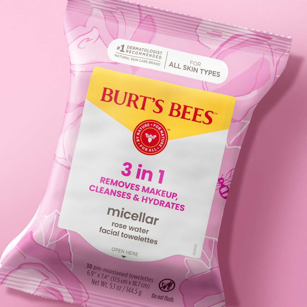 Burt's Bees towelette next to hand for size and scale reference