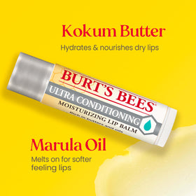 Burt's Bees tubes in hand demonstrating pocket-size portability and easy carry