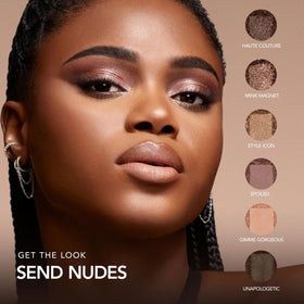 BUXOM palette held in hand to show compact size and travel ease