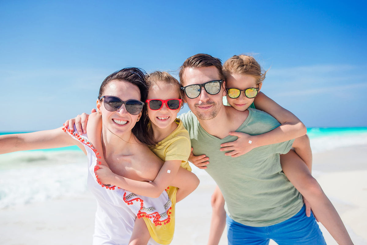 BUZZPATCH in a beach scene with family showing worry-free outdoor fun benefit