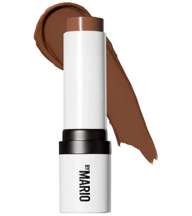 BY MARIO applying shaping stick to cheeks with brush for natural matte definition