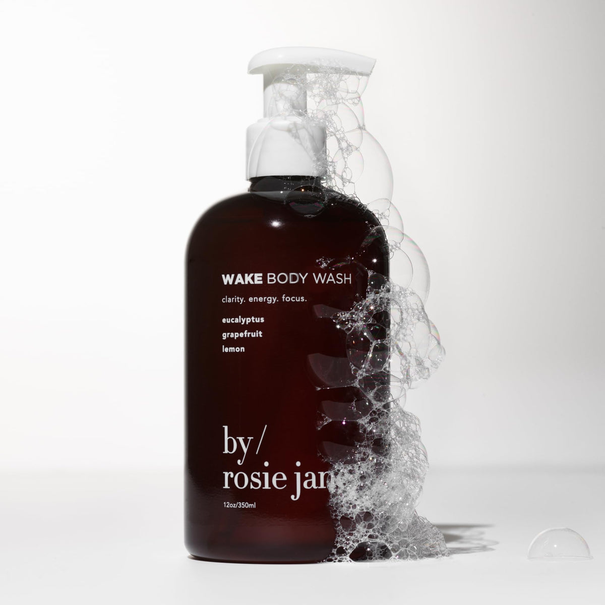 By Rosie Jane Wake bottle on shower shelf demonstrating easy everyday use benefit
