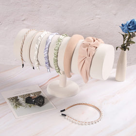 ByKen displaying earrings on bar for tidy, visible organization benefit