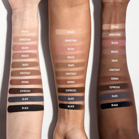 BY MARIO model applying taupe cream eyeshadow demonstrating long-wear, crease-resistant benefit