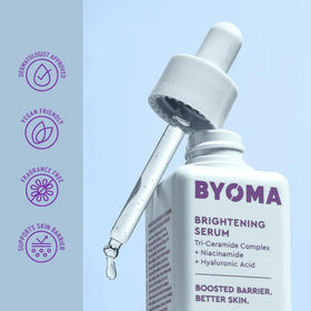 Hand holding BYOMA bottle to show size and easy daily use