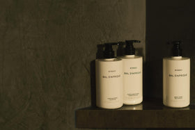 Byredo Bal d'Afrique bottles in-shower use showing practical ergonomics and hotel-quality experience